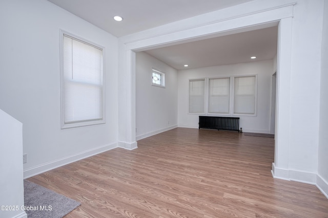 1538 Nott St, Schenectady, NY 12308 - spare room with radiator heating unit, baseboards, light wood-style flooring, and recessed lighting