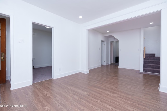 1538 Nott St, Schenectady, NY 12308 - unfurnished living room with wood finished floors, stairs, recessed lighting, and baseboards
