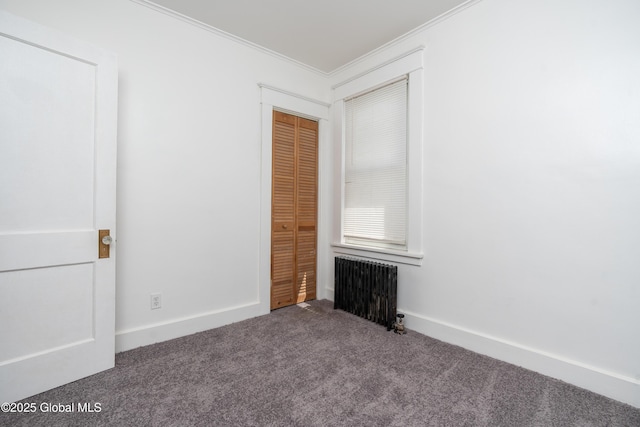 1538 Nott St, Schenectady, NY 12308 - unfurnished bedroom featuring radiator heating unit, carpet flooring, ornamental molding, a closet, and baseboards