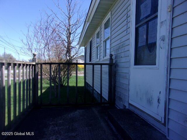 view of side of property featuring fence