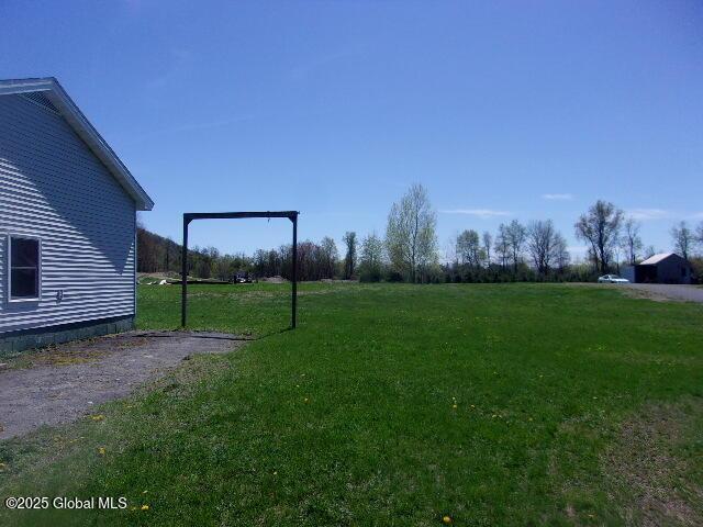 view of yard featuring a carport