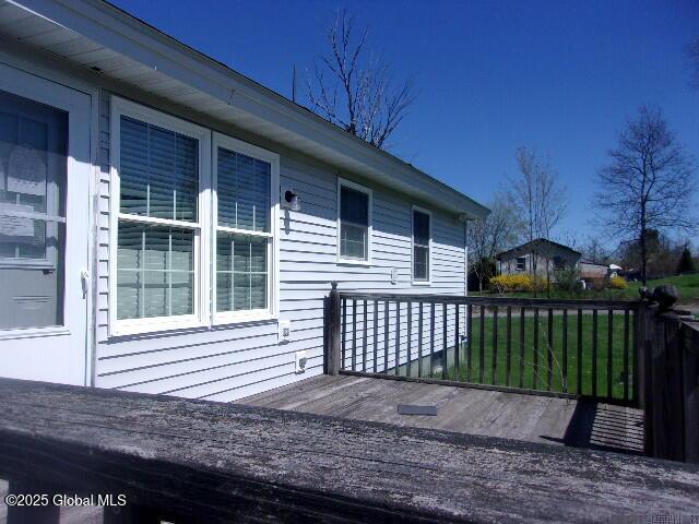 deck featuring a lawn