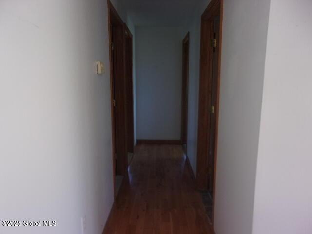 hall with wood finished floors