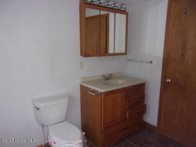bathroom with toilet and vanity