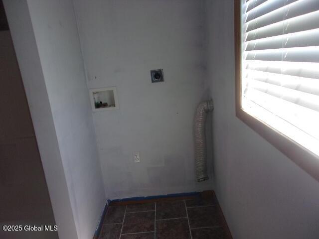 washroom featuring baseboards, hookup for an electric dryer, laundry area, and hookup for a washing machine