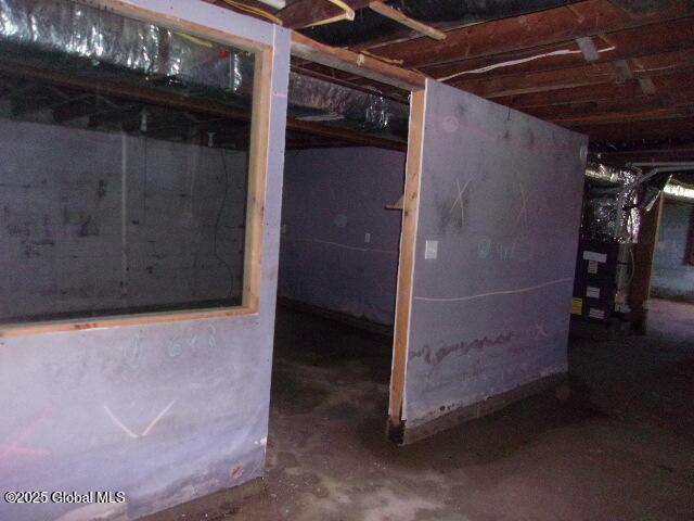 unfinished basement with heating unit
