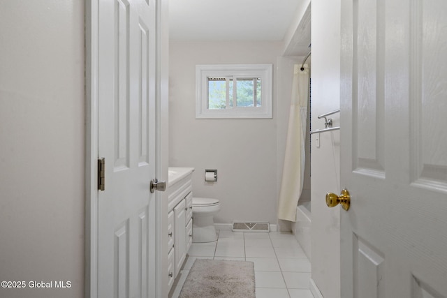 bathroom with toilet, vanity, tile patterned floors, baseboards, and shower / tub combo with curtain