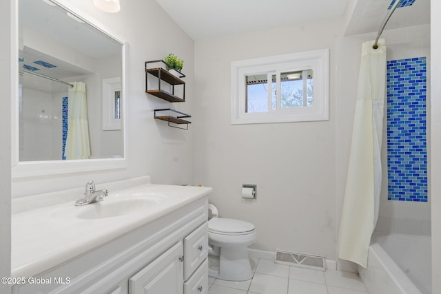 bathroom with tile patterned floors, toilet, vanity, and baseboards