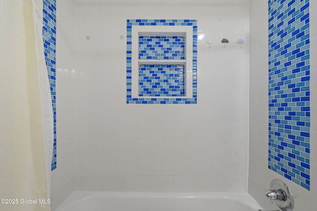 bathroom with shower / bathtub combination with curtain