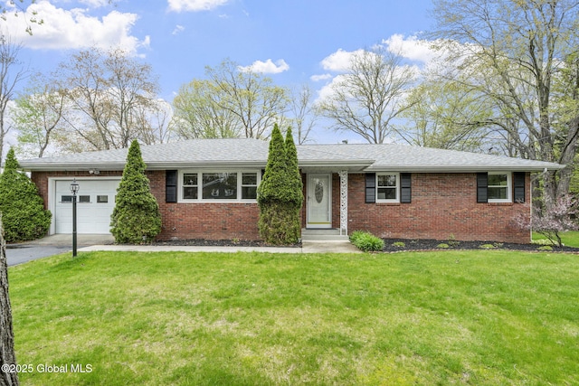ranch-style house with a garage, brick siding, asphalt driveway, and a front lawn