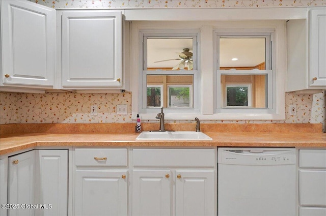 kitchen with dishwasher, white cabinetry, a sink, light countertops, and ceiling fan