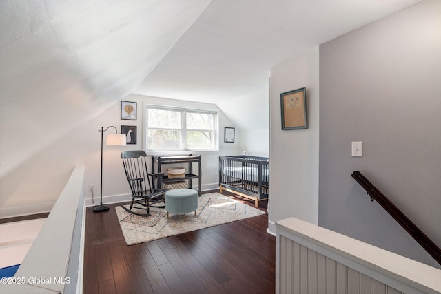 office space featuring baseboards, lofted ceiling, and dark wood-style floors