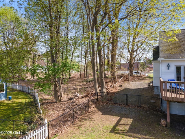 view of yard with a fenced backyard and a deck