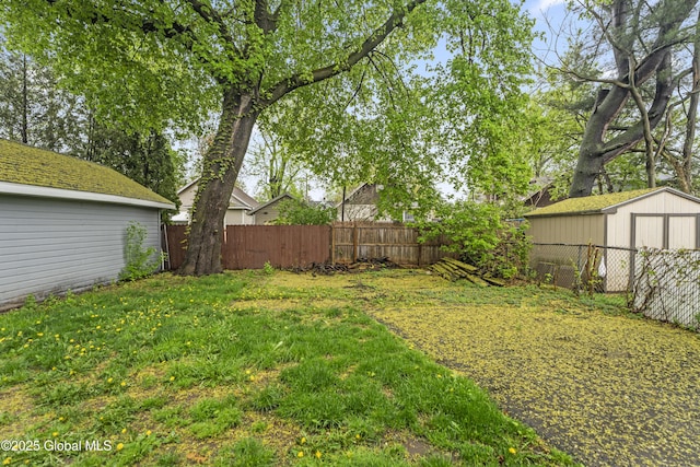 view of yard with an outbuilding and a shed