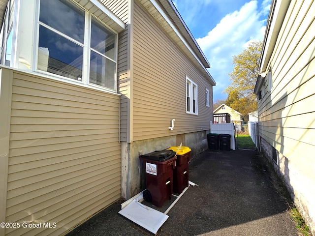 view of property exterior with fence