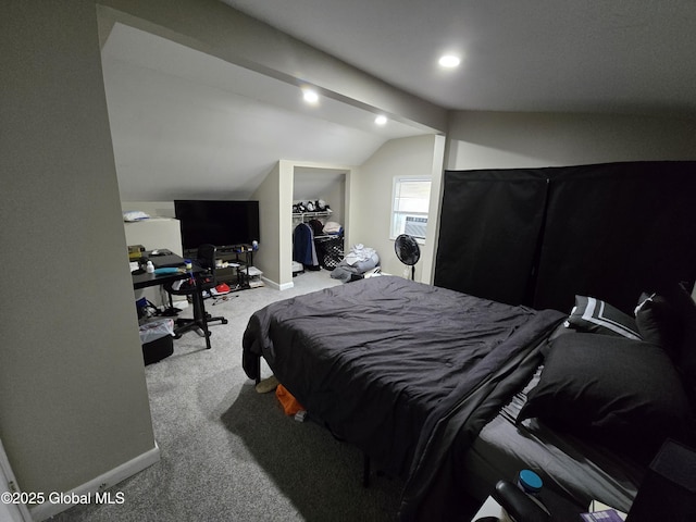 carpeted bedroom with baseboards and lofted ceiling