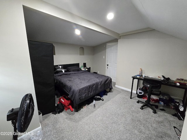 carpeted bedroom featuring baseboards and lofted ceiling
