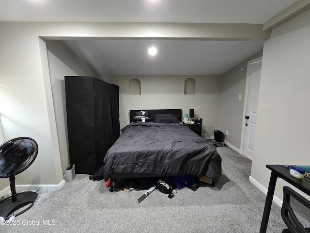 bedroom featuring baseboards and carpet