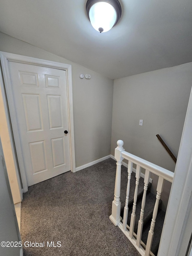 stairs with carpet floors and baseboards