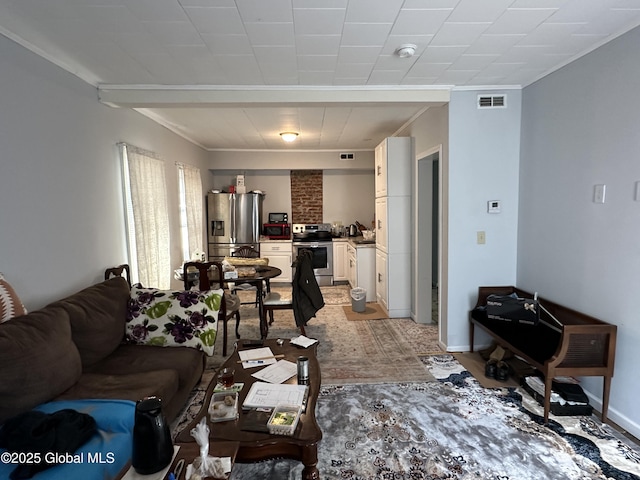 18 Ingersoll Ave, Schenectady, NY 12305 - living area with crown molding, baseboards, and visible vents