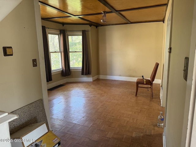 empty room featuring baseboards
