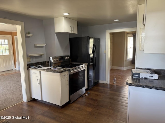 kitchen with electric range, recessed lighting, white cabinetry, dark wood finished floors, and black fridge