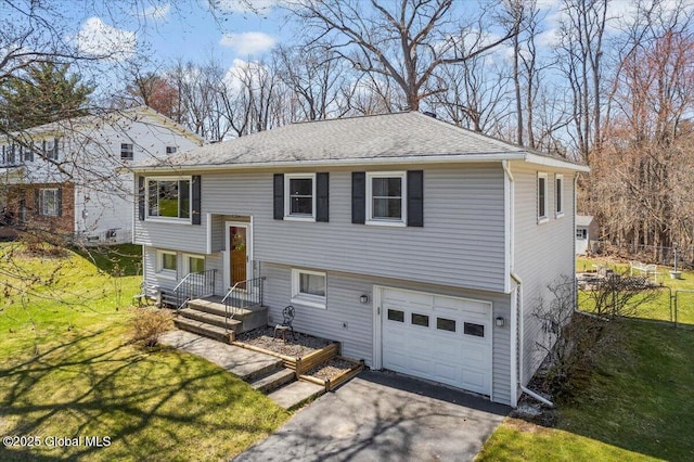 67 Fairlawn Dr, Colonie, NY 12110 - raised ranch with a garage, asphalt driveway, and a shingled roof