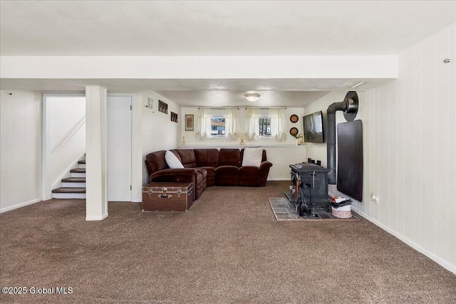 67 Fairlawn Dr, Colonie, NY 12110 - carpeted living area featuring a wood stove and stairway