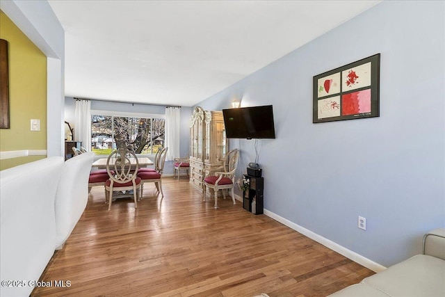 67 Fairlawn Dr, Colonie, NY 12110 - living area featuring light wood-type flooring, baseboards, and lofted ceiling