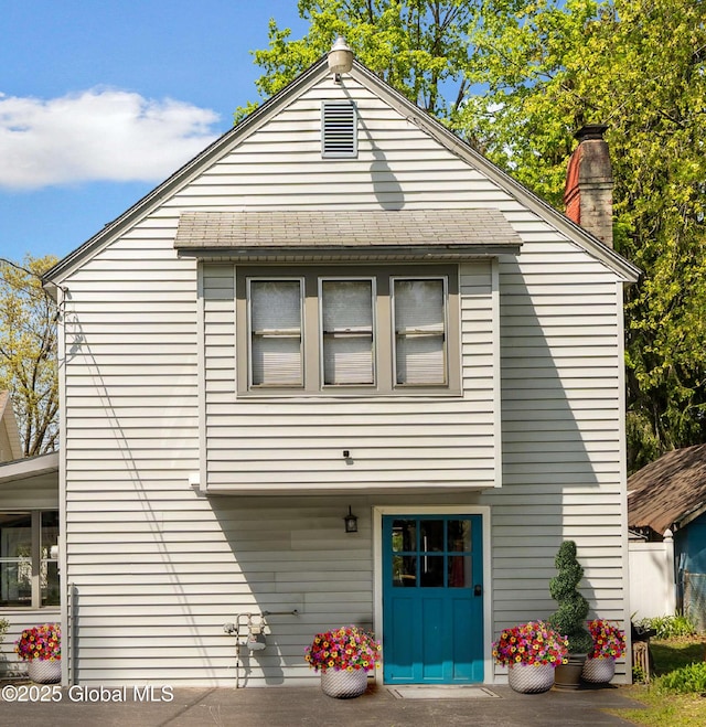 41 Madison St, Saratoga Springs, NY 12866 - back of house featuring a chimney and a shingled roof