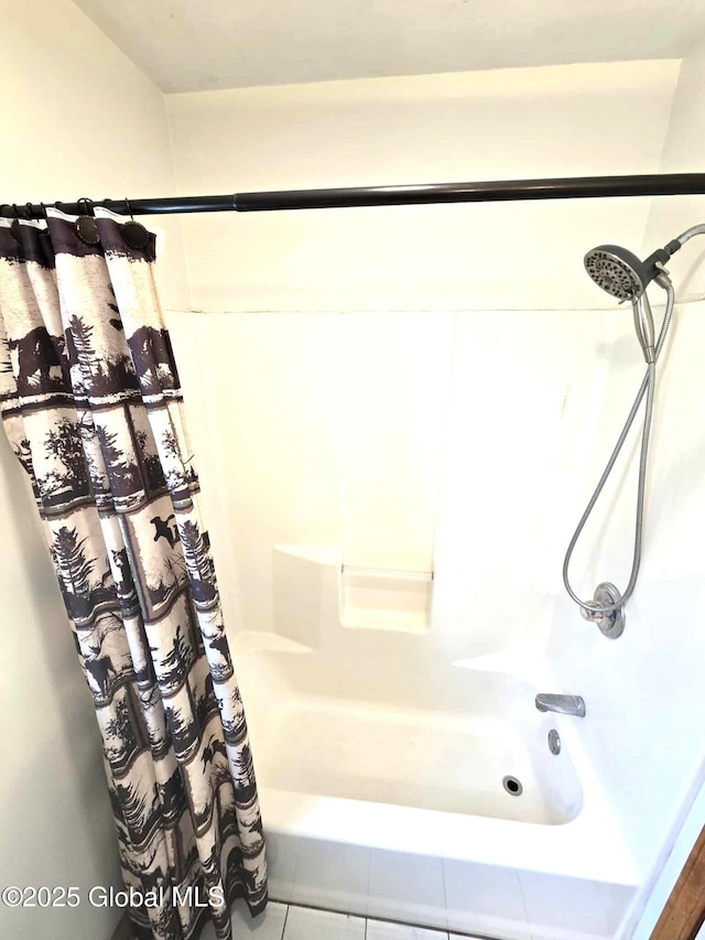 full bathroom featuring tile patterned floors and shower / bath combo