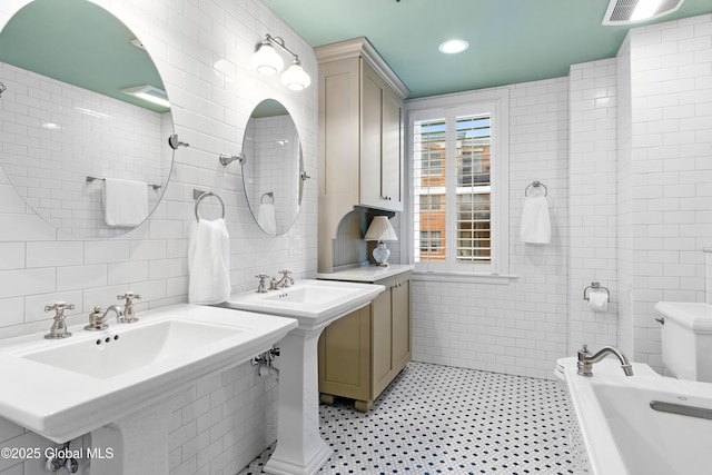 73 Railroad Pl Unit 403-404, Saratoga Springs, Inside, NY 12866 - bathroom with tile walls and toilet