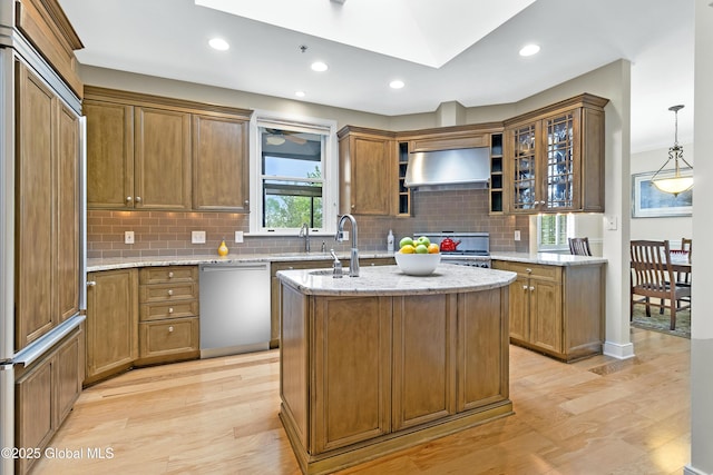 73 Railroad Pl Unit 403-404, Saratoga Springs, Inside, NY 12866 - kitchen featuring dishwasher, paneled fridge, ventilation hood, light wood finished floors, and tasteful backsplash