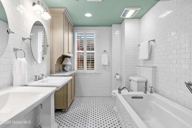 73 Railroad Pl Unit 403-404, Saratoga Springs, Inside, NY 12866 - bathroom featuring tile walls, toilet, tiled tub, and a sink