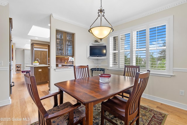 73 Railroad Pl Unit 403-404, Saratoga Springs, Inside, NY 12866 - dining area featuring light wood-style flooring, crown molding, baseboards, a skylight, and recessed lighting