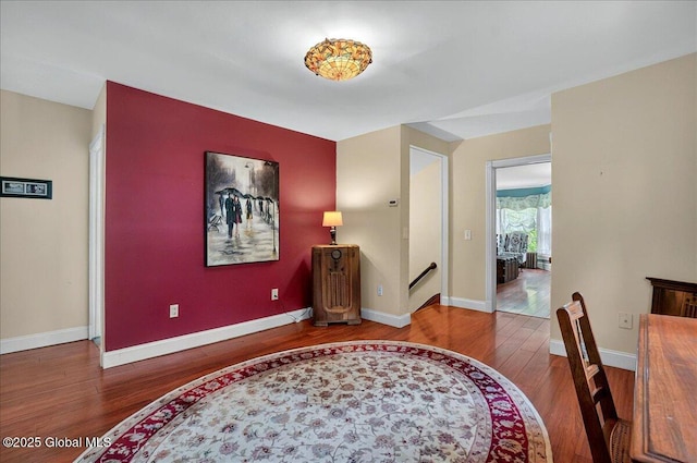 entrance foyer featuring wood finished floors and baseboards