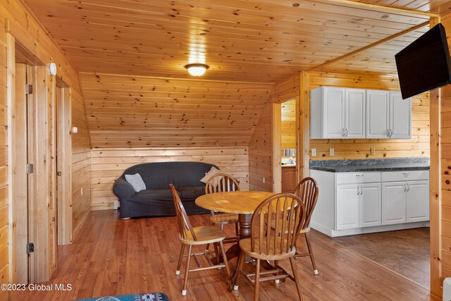 373 County Route 42, Fort Edward, NY 12828 - dining space with wooden walls, light wood-type flooring, and wooden ceiling