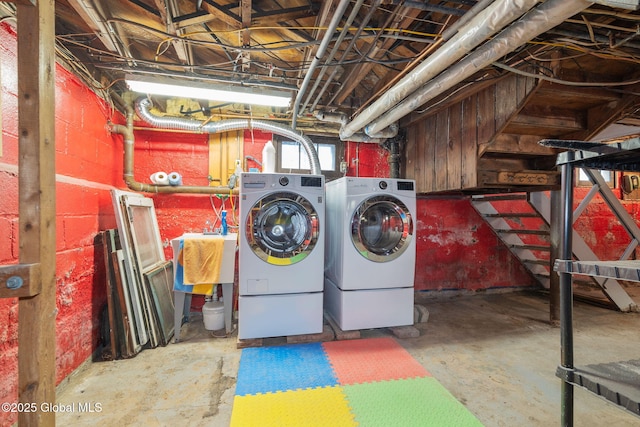 clothes washing area featuring laundry area and washer and dryer