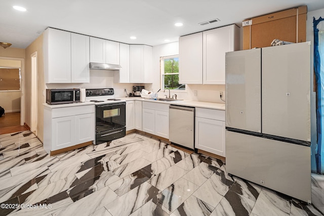 kitchen featuring a sink, freestanding refrigerator, under cabinet range hood, stainless steel dishwasher, and electric stove