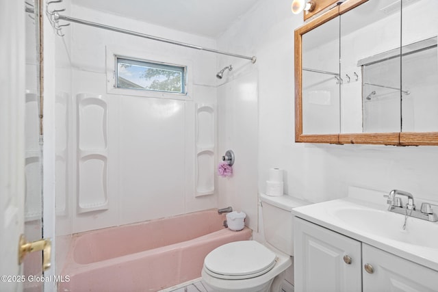 bathroom with vanity, toilet, and washtub / shower combination
