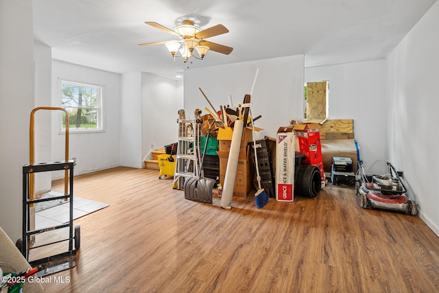 interior space featuring a ceiling fan and wood finished floors