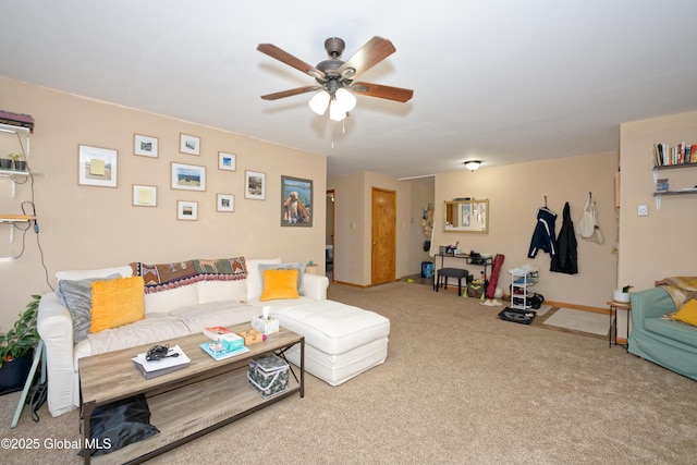 carpeted living area featuring baseboards and ceiling fan