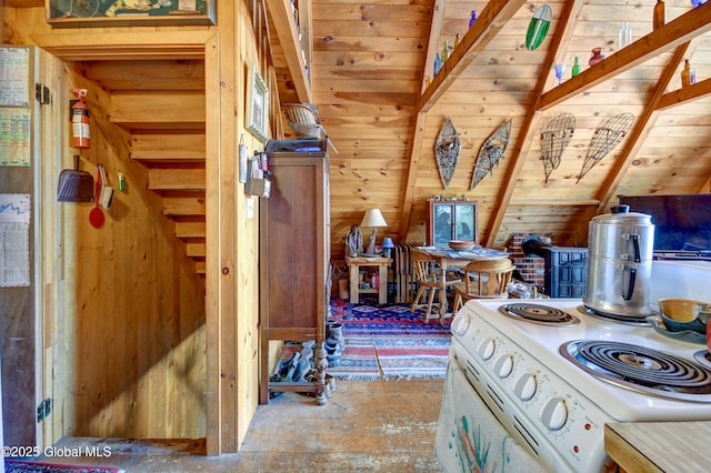 kitchen featuring wood walls and electric range