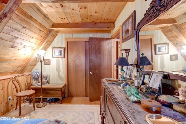 interior space with wooden walls, wallpapered walls, wood ceiling, and wood finished floors