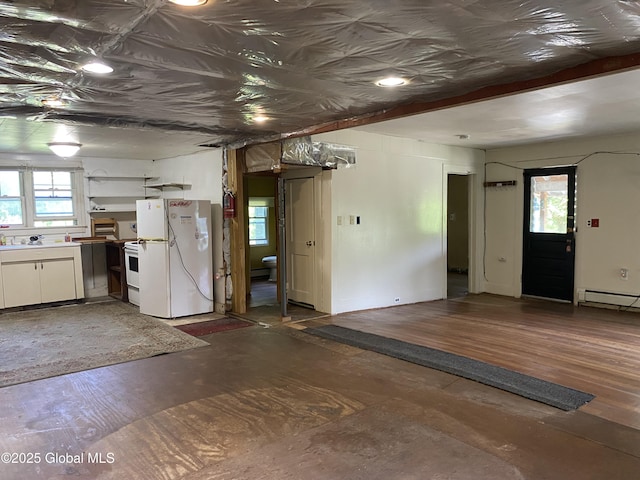 18751 State Route 22, Petersburgh, NY 12138 - kitchen with freestanding refrigerator, wood finished floors, and a baseboard radiator