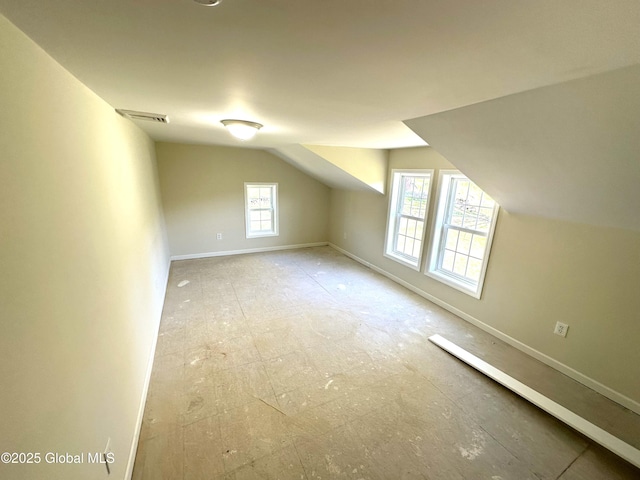 bonus room featuring vaulted ceiling, baseboards, and visible vents