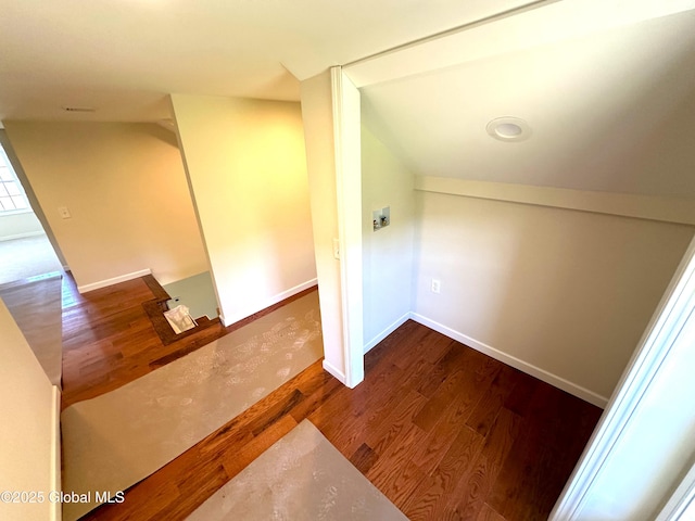 additional living space featuring wood finished floors