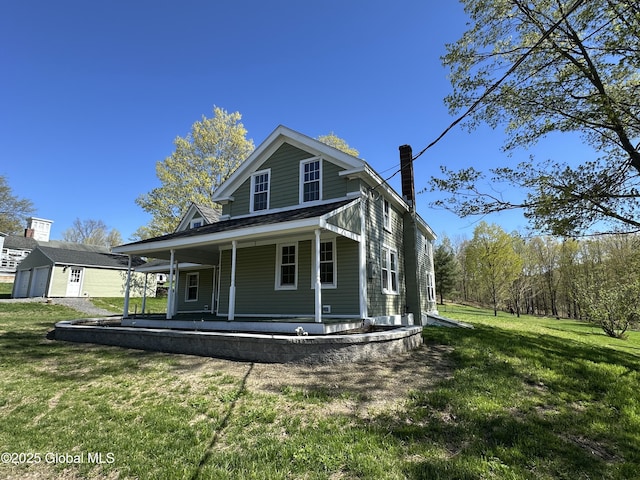 rear view of property featuring a porch, a chimney, and a lawn