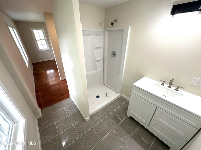 1108 State Route 295, Chatham, NY 12060 - bathroom with a stall shower, baseboards, and vanity