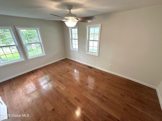 1108 State Route 295, Chatham, NY 12060 - unfurnished room with baseboards, ceiling fan, and wood finished floors